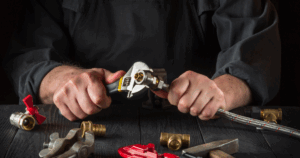 Licensed plumber performing safe gas line installation with wrench and fittings in Las Vegas